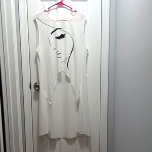 Cute  Shark Bite Style Top, White Color, With Printed Female Face In The Front.